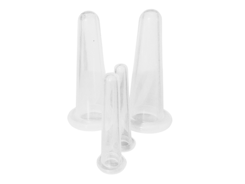 Four clear plastic silicone facial cups of different sizes, arranged on a seamless white background.