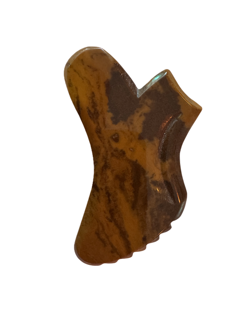 Mookaite Gua Sha stone with a unique shape on a white background